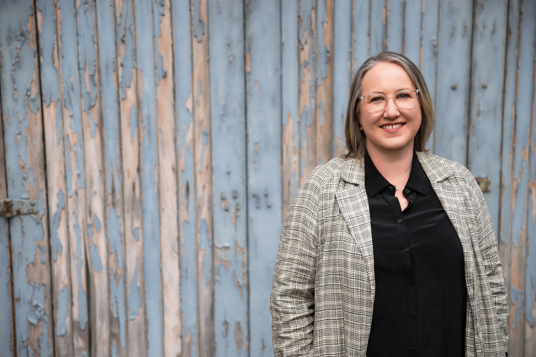 Photo of Megan Reid with her core business vision of "working with leaders and managers to be effective at 'Leading Through Others'".